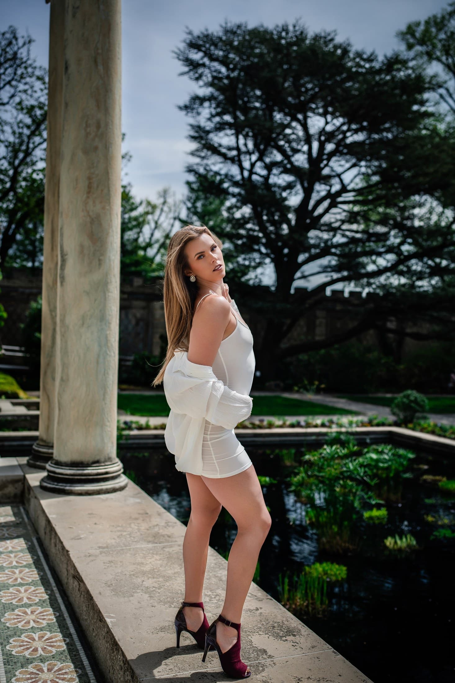 Molly Hagman by a garden pond in white for Spring shoot by Alexis Pesante 2025