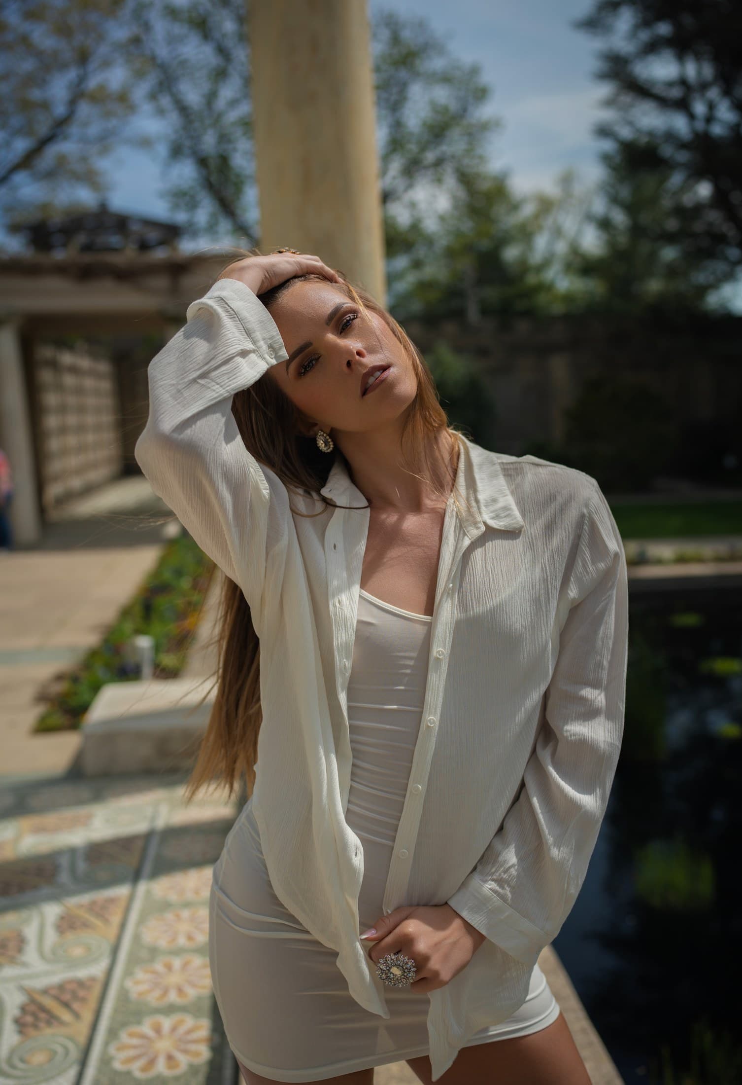 Molly Hagman standing by a column and pond — Spring shoot by Alexis Pesante 2025