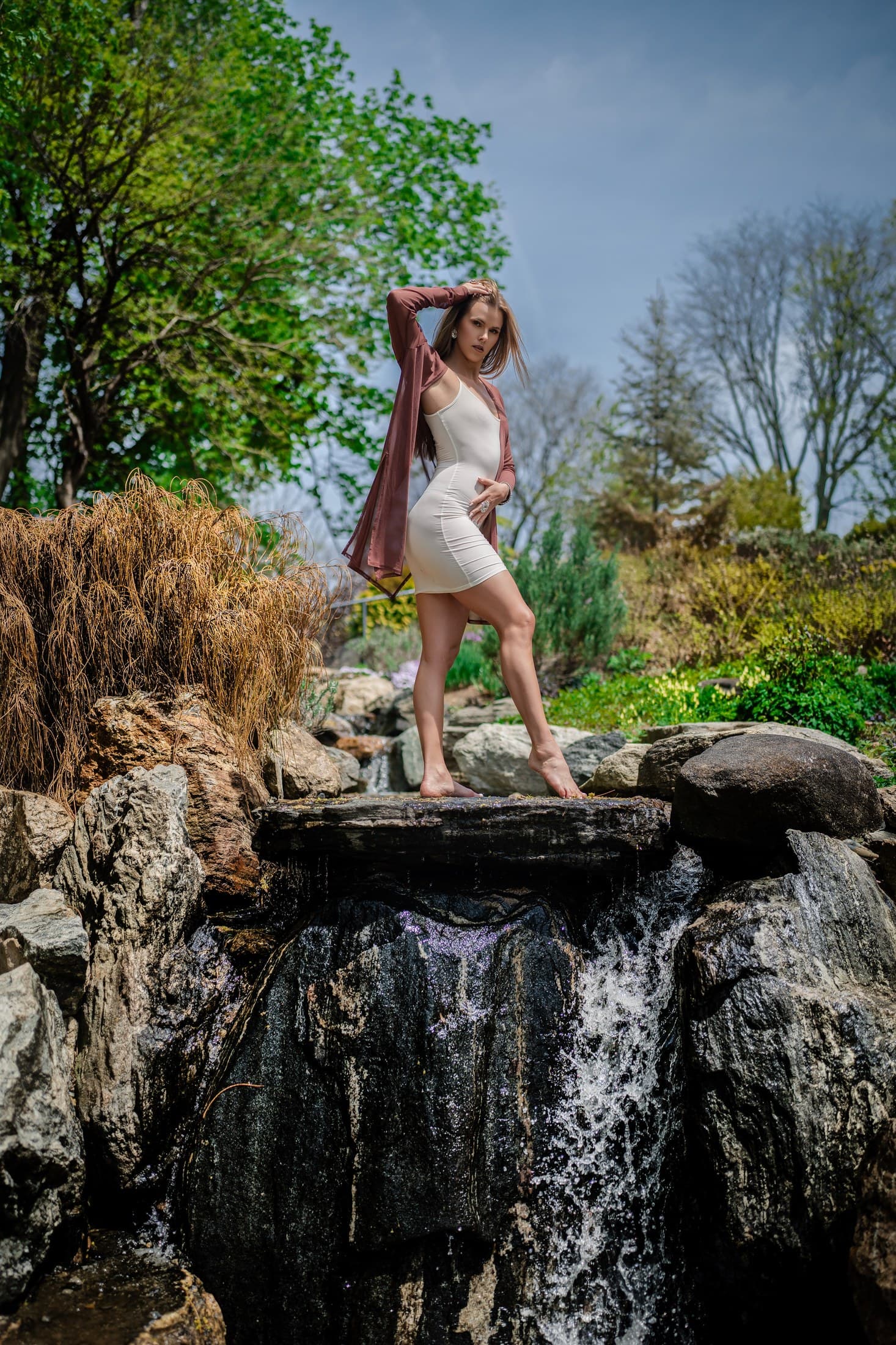 Molly Hagman on a garden waterfall rock — Spring shoot by Alexis Pesante 2025