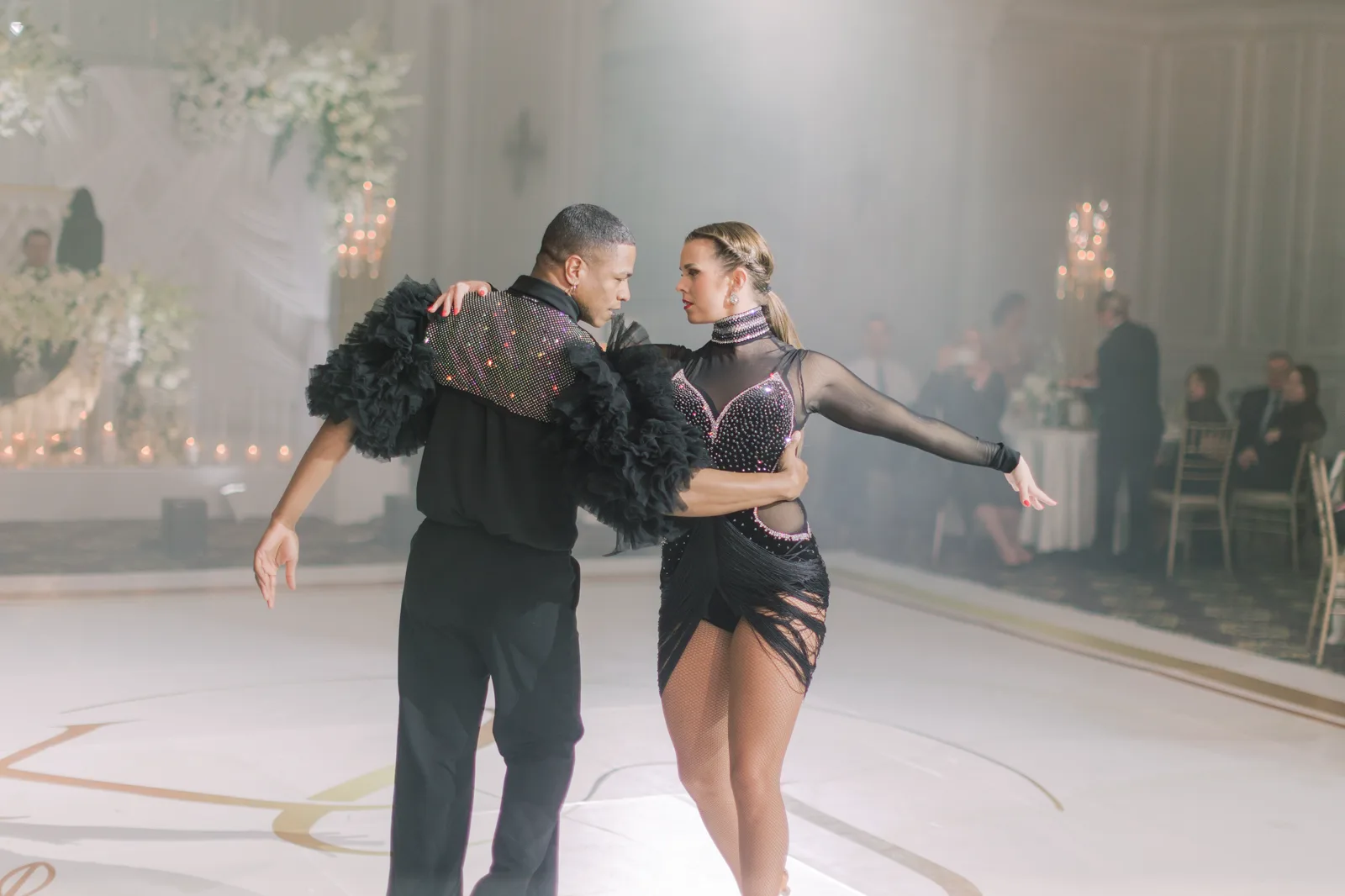 Molly Hagman performing choreographed Latin dance at an elegant event